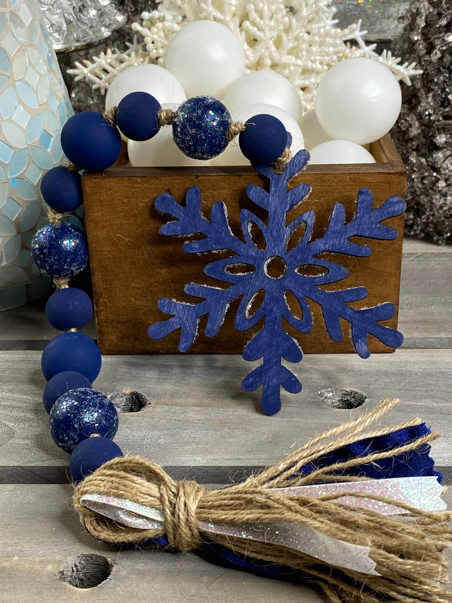 Glittered Blue Snowflake Wood Bead Garland