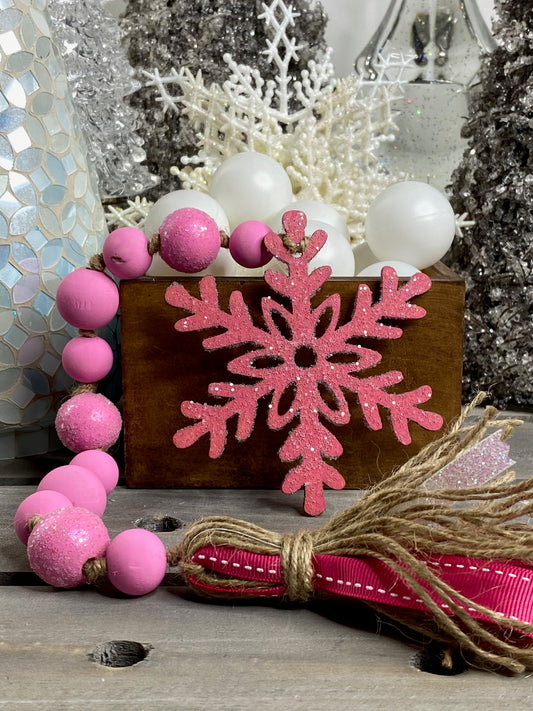 Glittered Pink Snowflake Wood Bead Garland